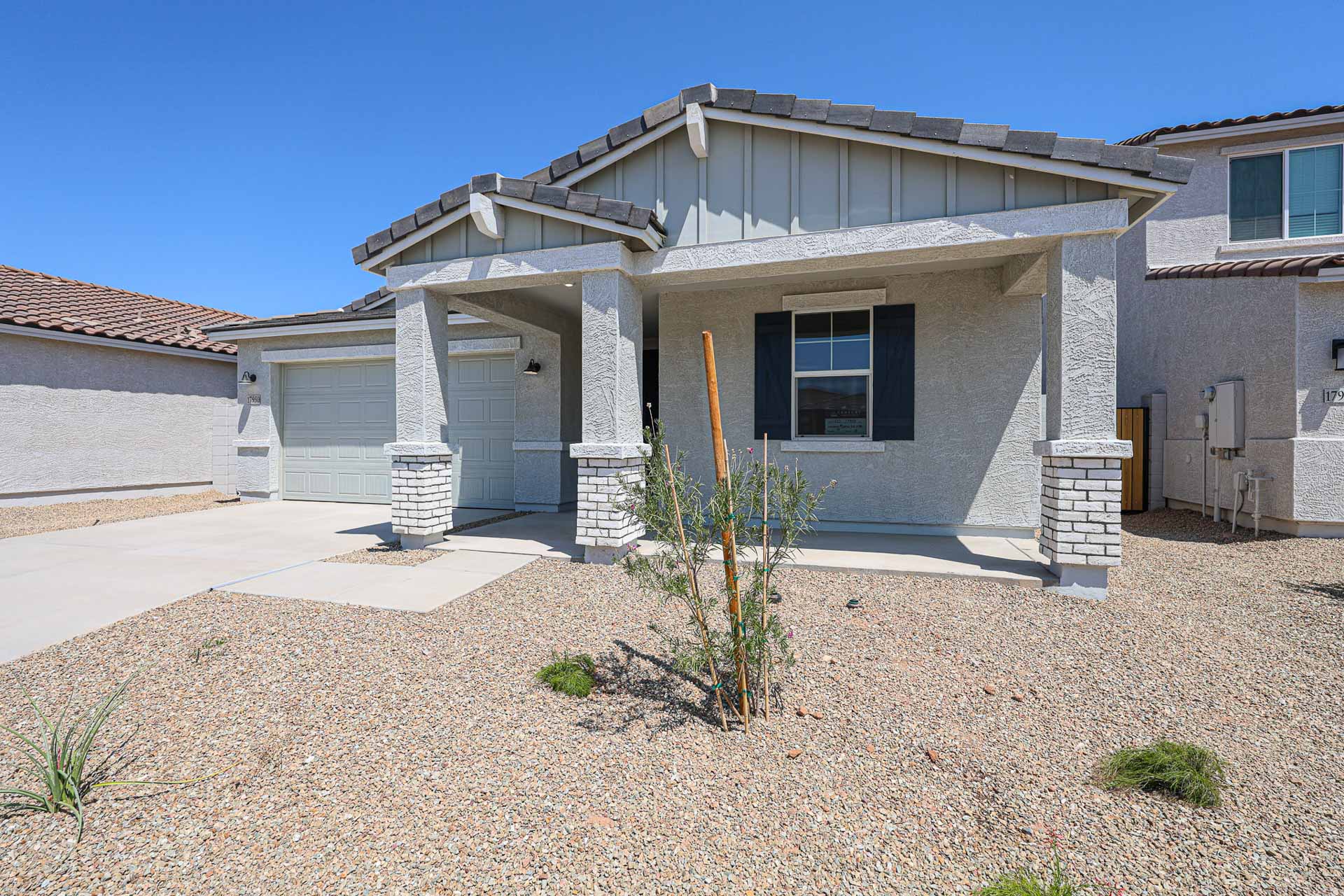 A house with a stone patio.