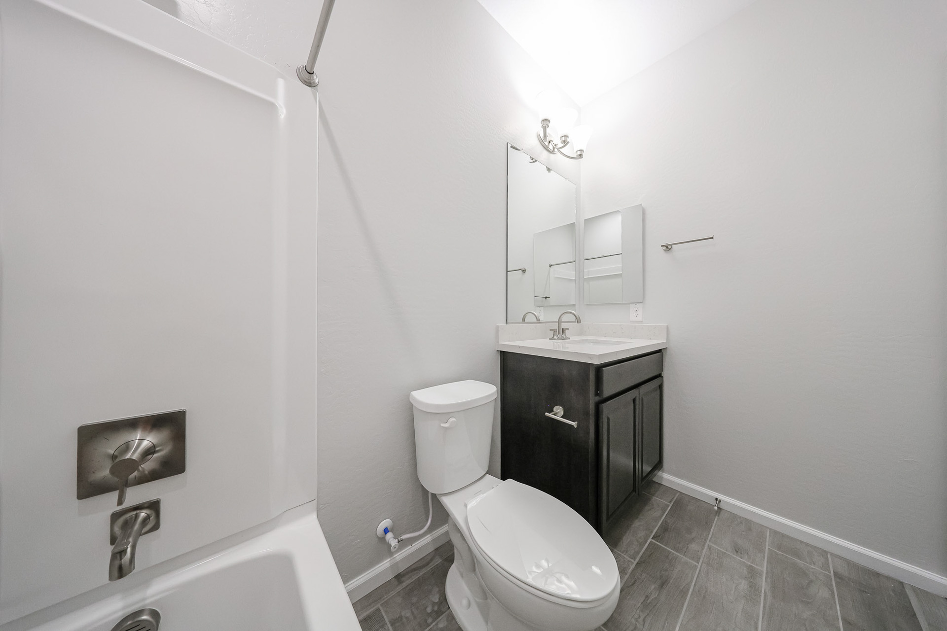 A bathroom with a toilet and sink.