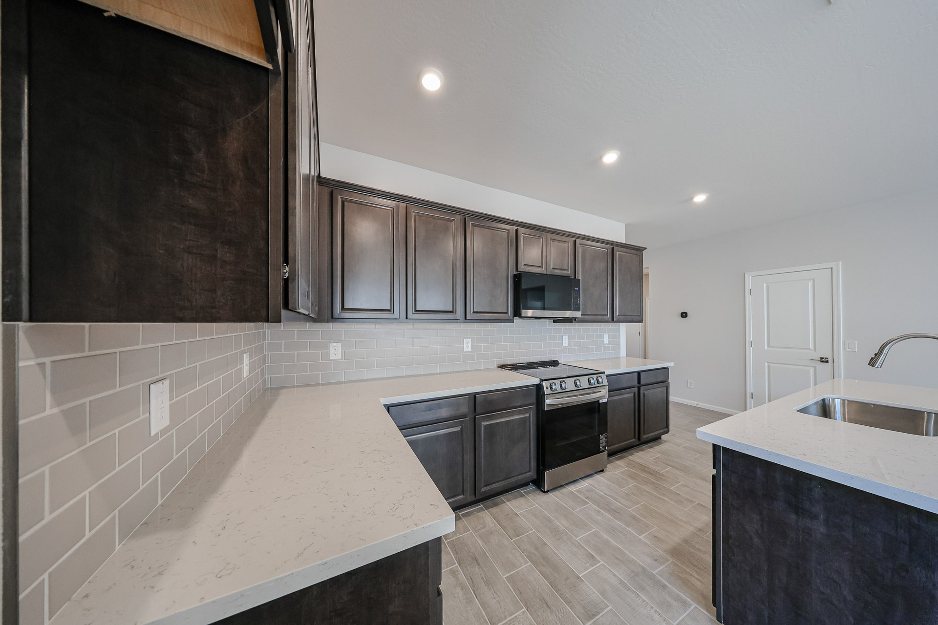 A kitchen with black appliances.