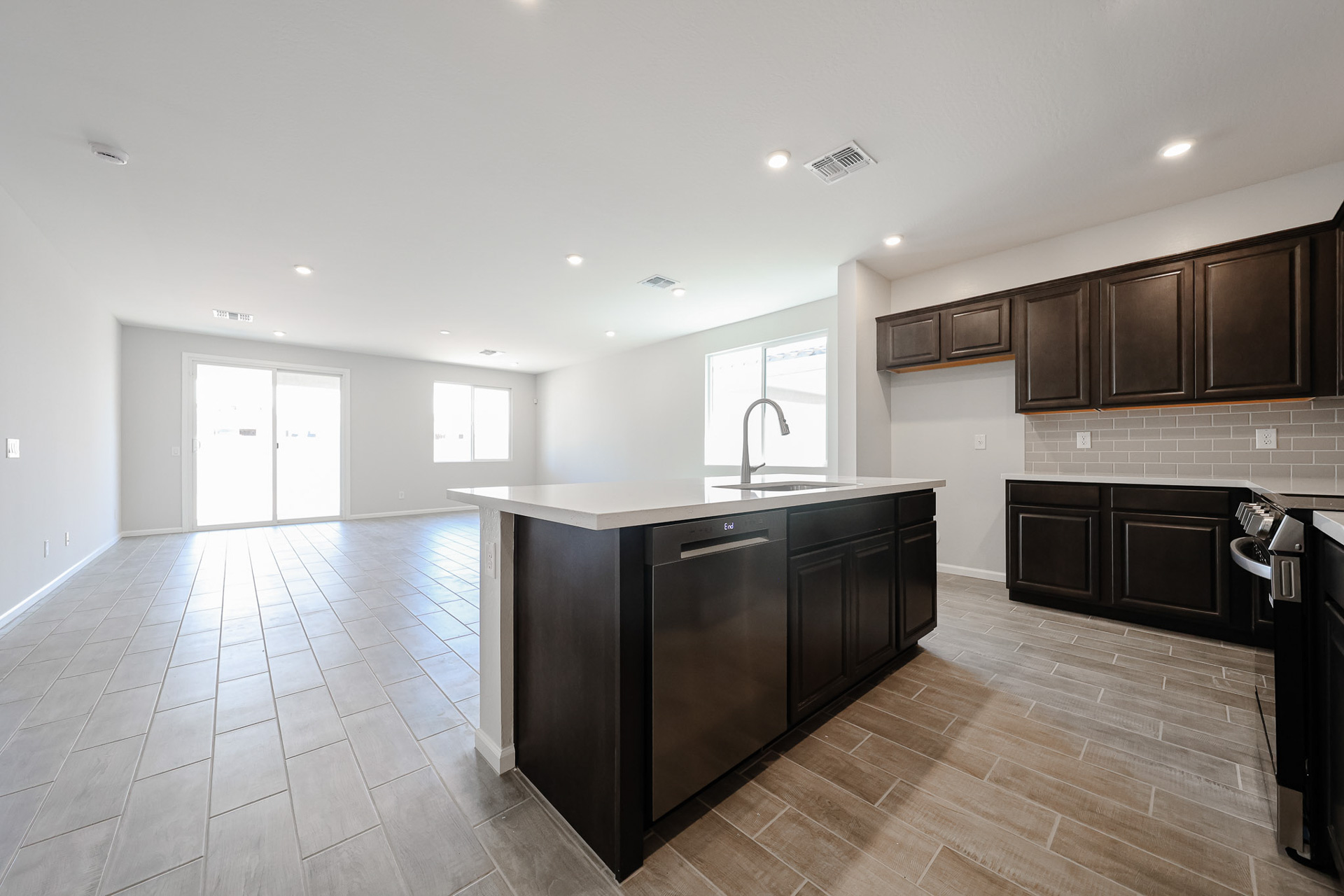 A kitchen with black appliances.