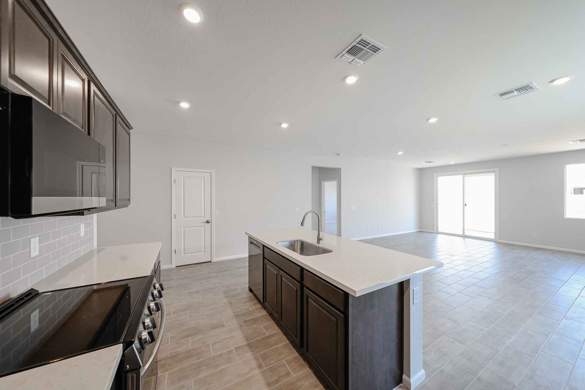 A kitchen with a marble countertop.