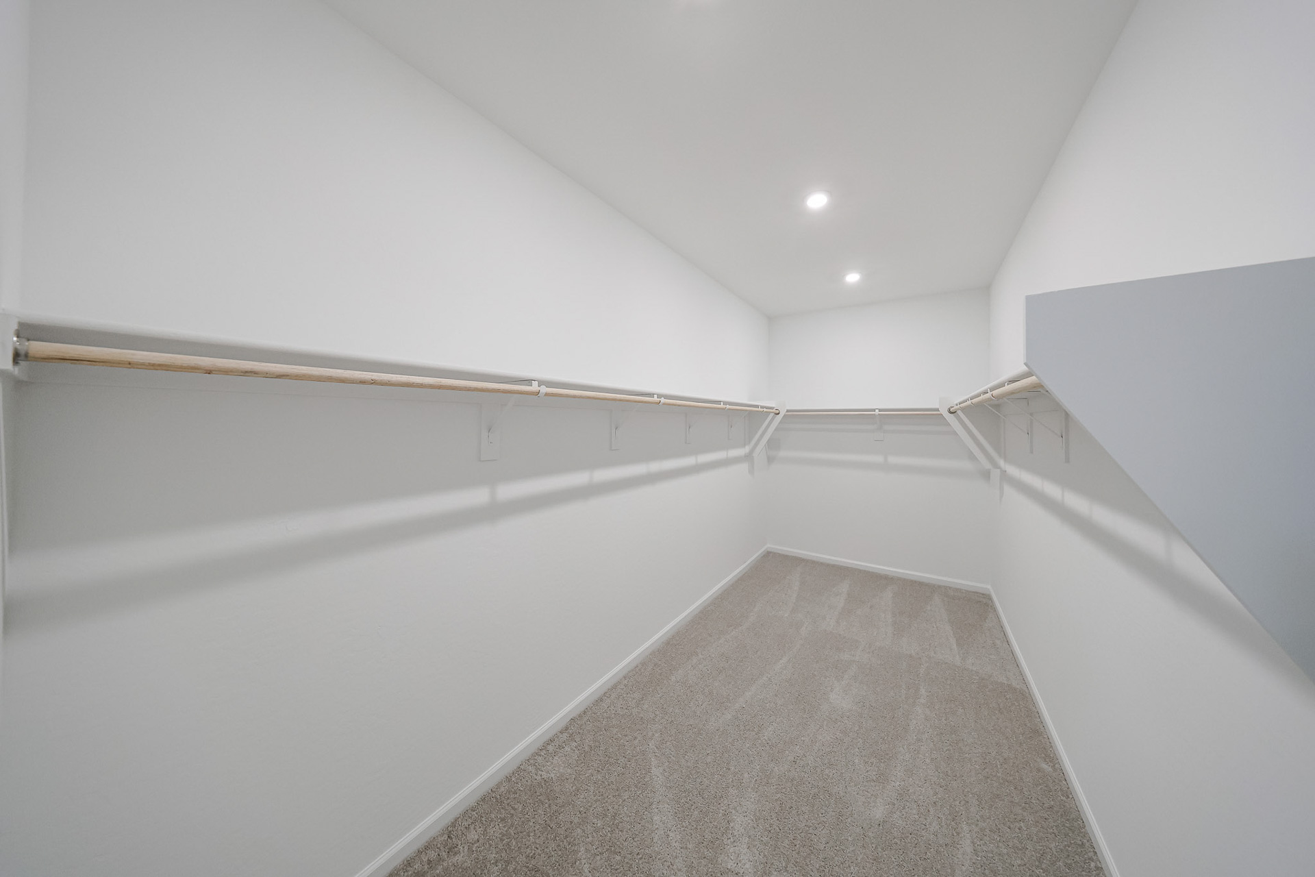 A long hallway with white walls.