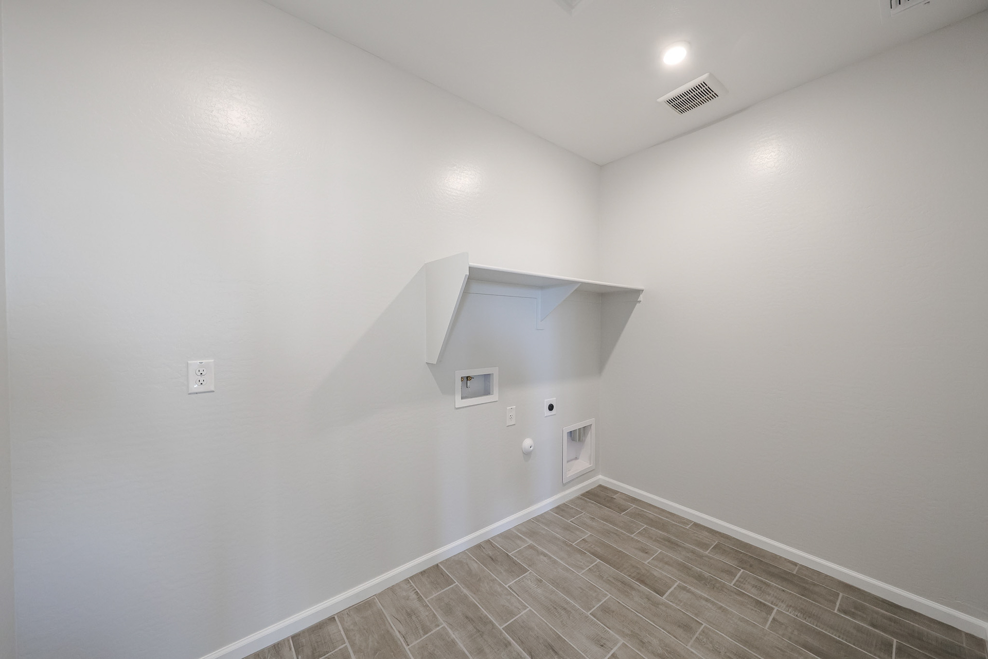 A hallway with a tile floor.