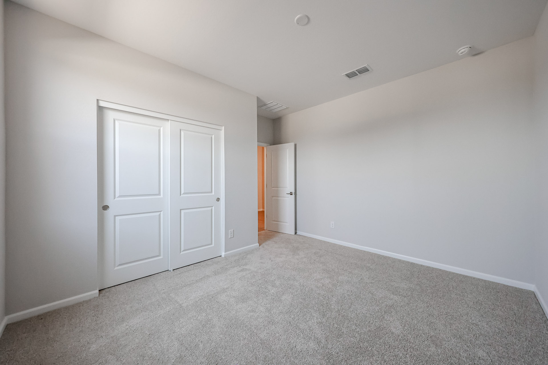 A room with white doors.