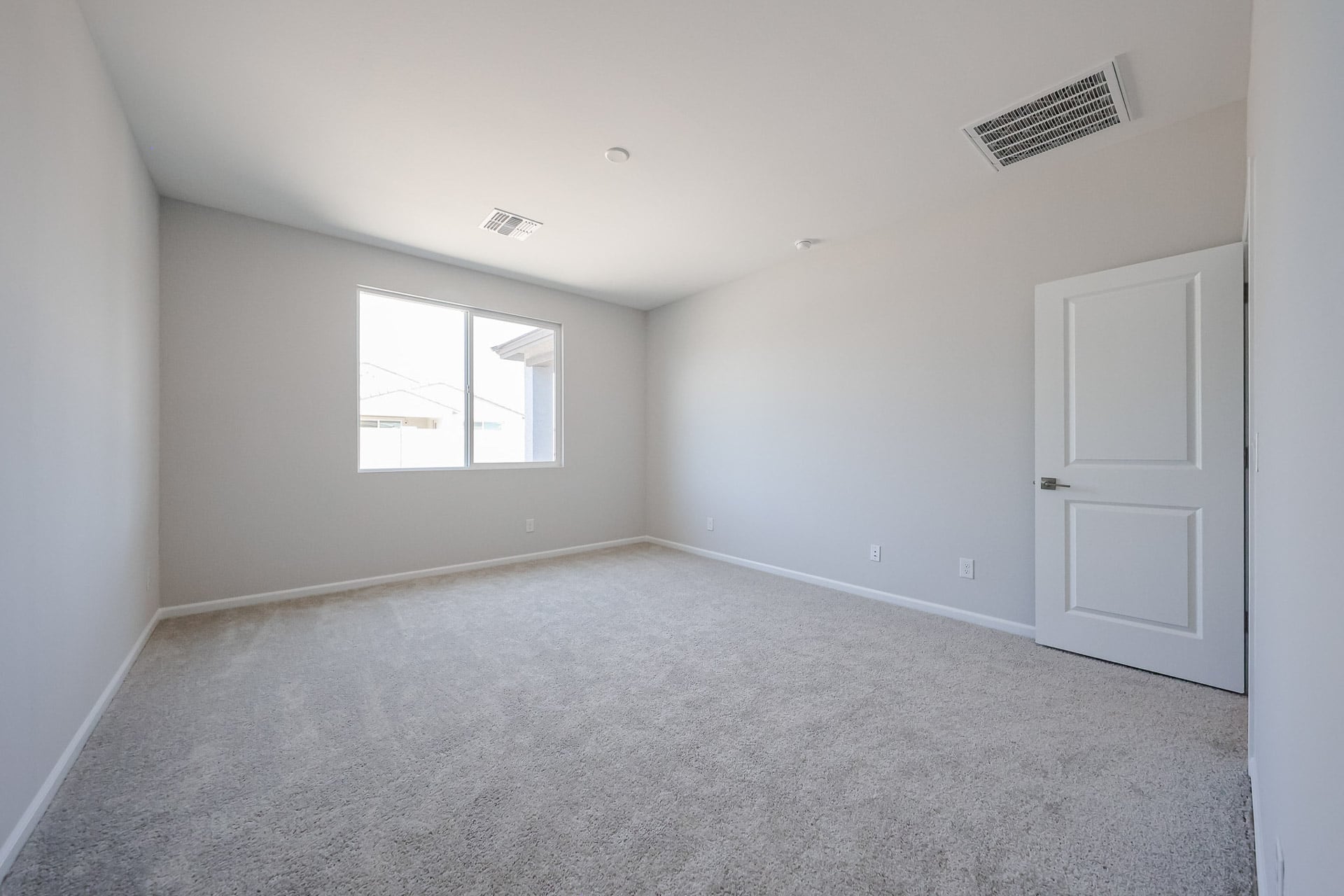 A room with a door and a window.