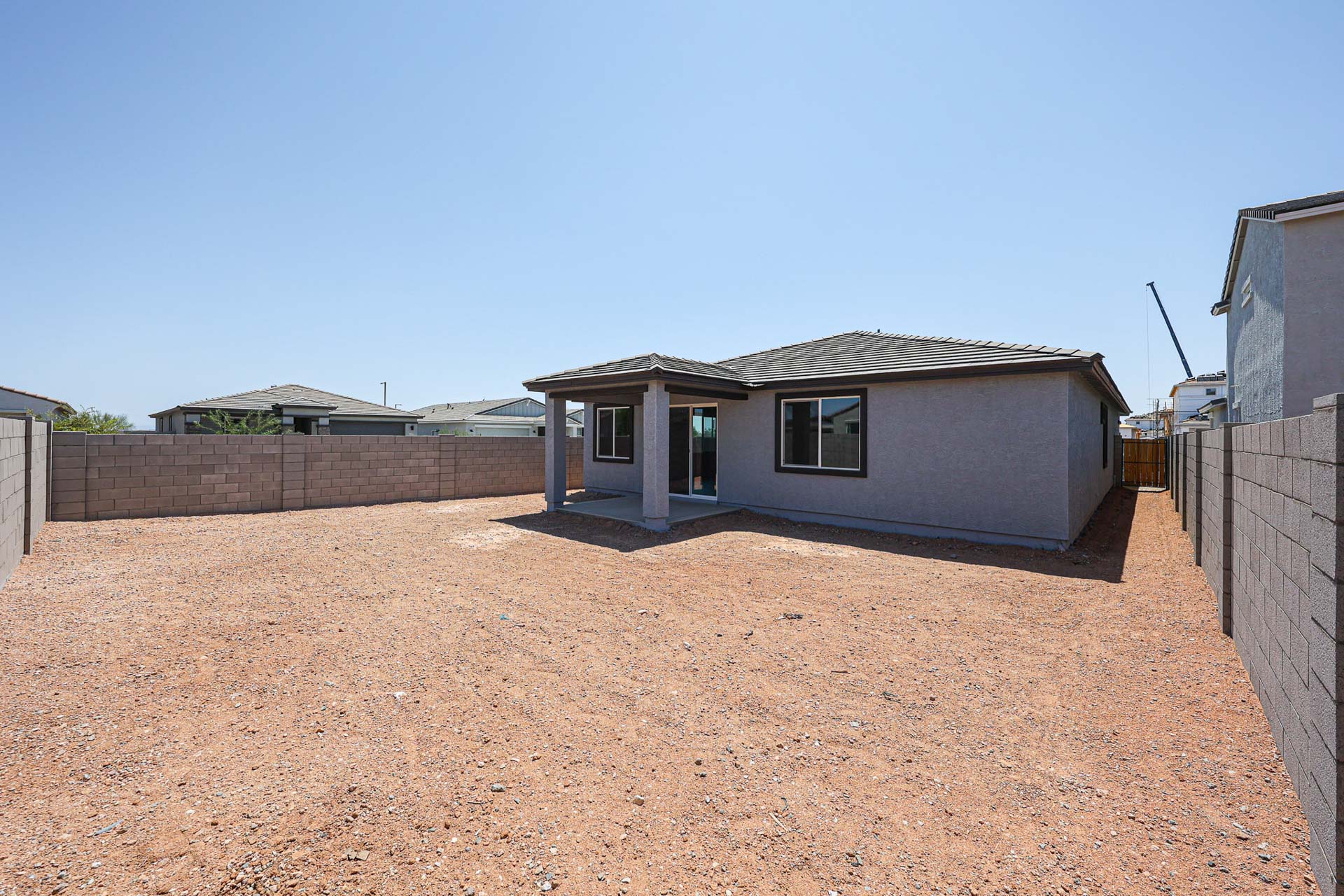 A house with a dirt yard.