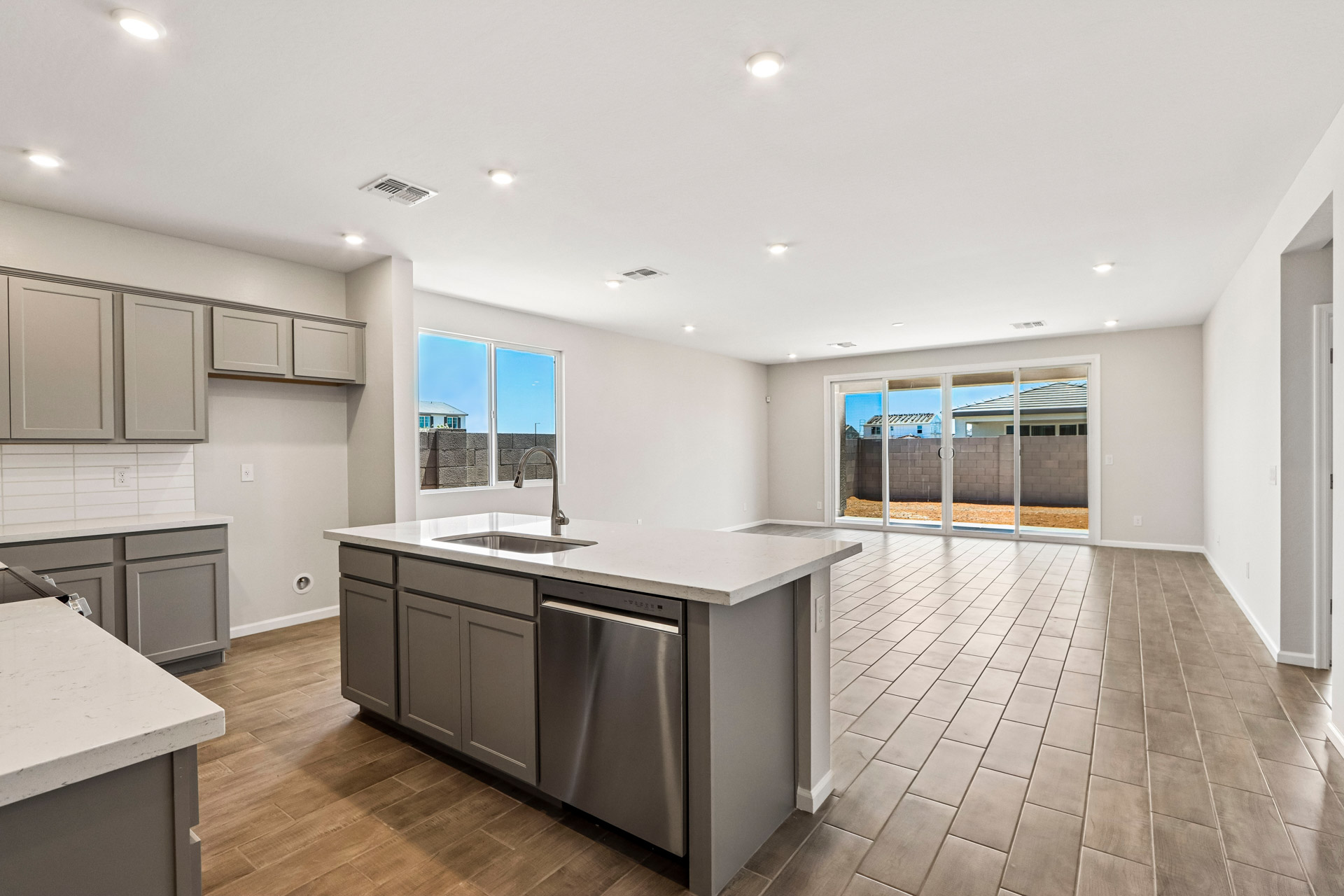 A kitchen with white cabinets.