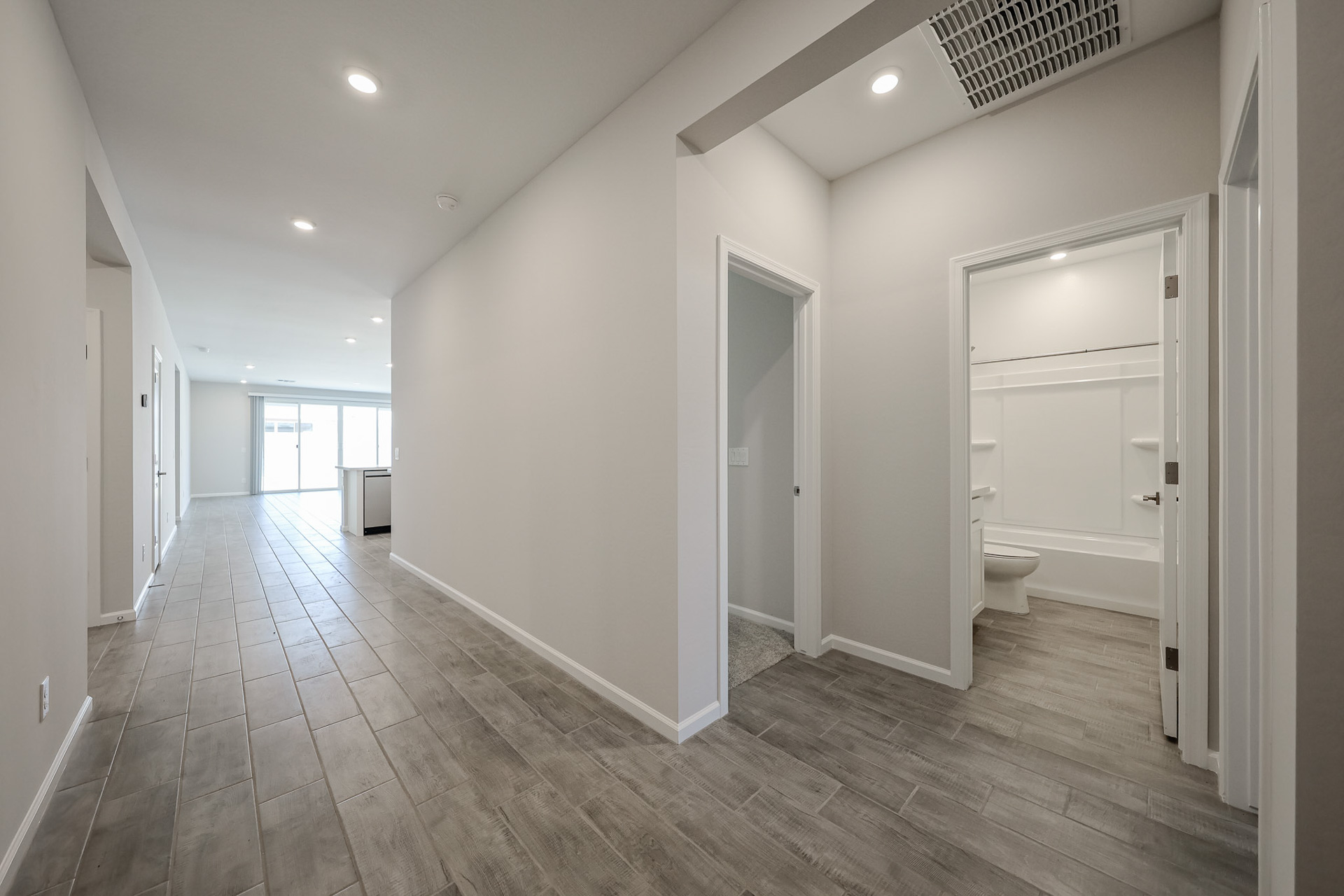 A bathroom with a wood floor.
