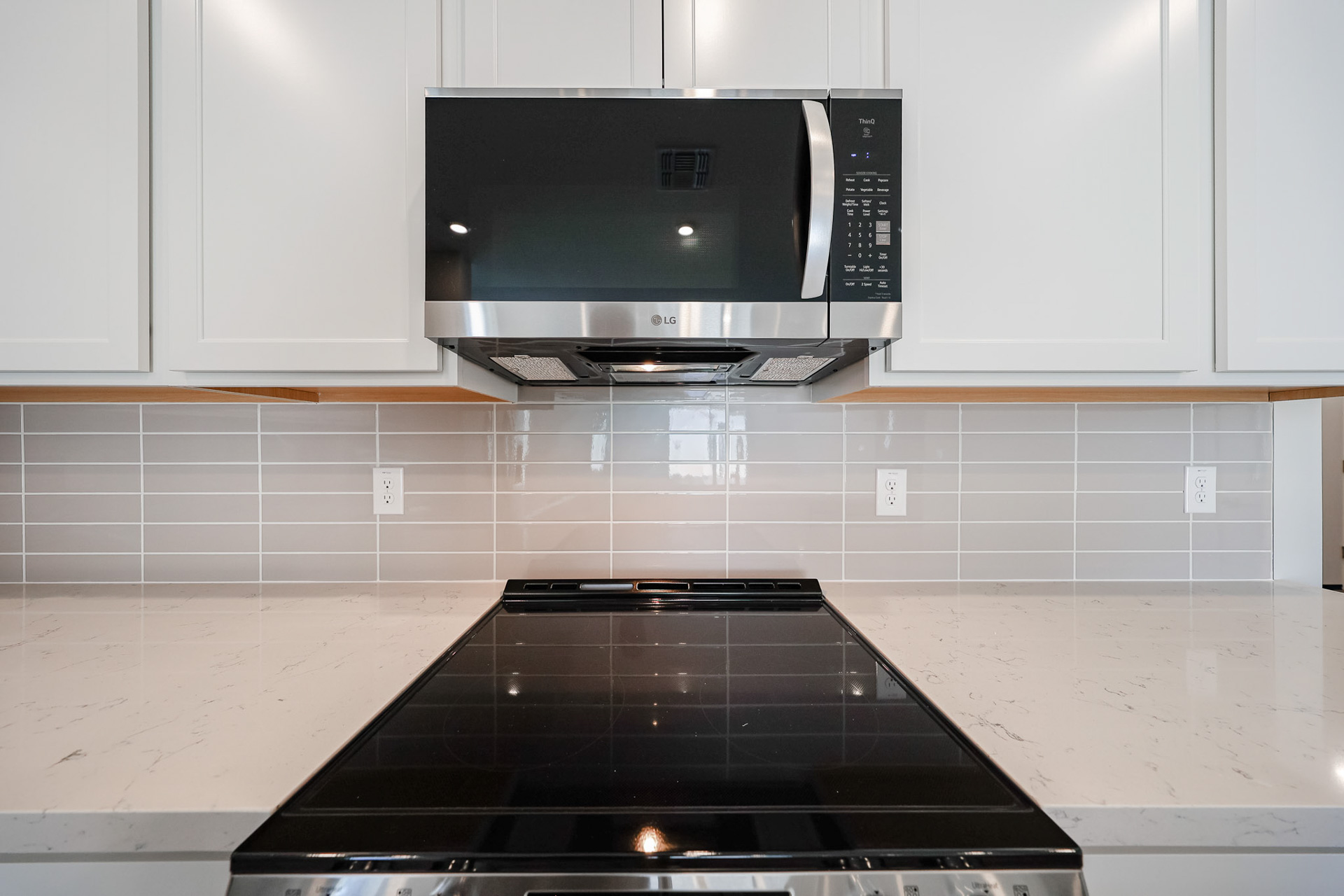 A microwave oven and a microwave in a kitchen.