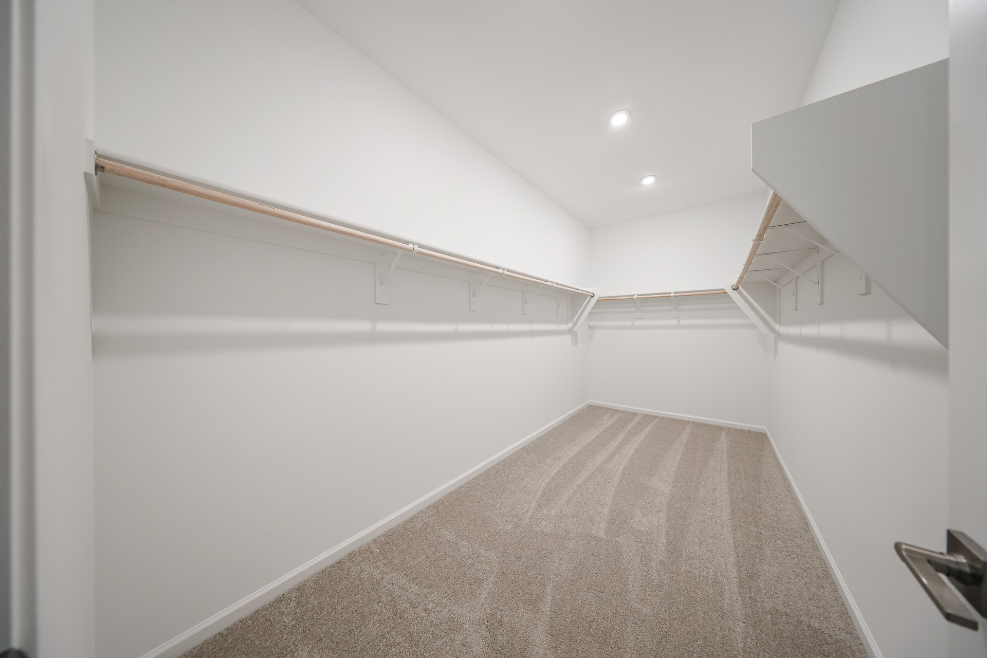 A hallway with white walls.