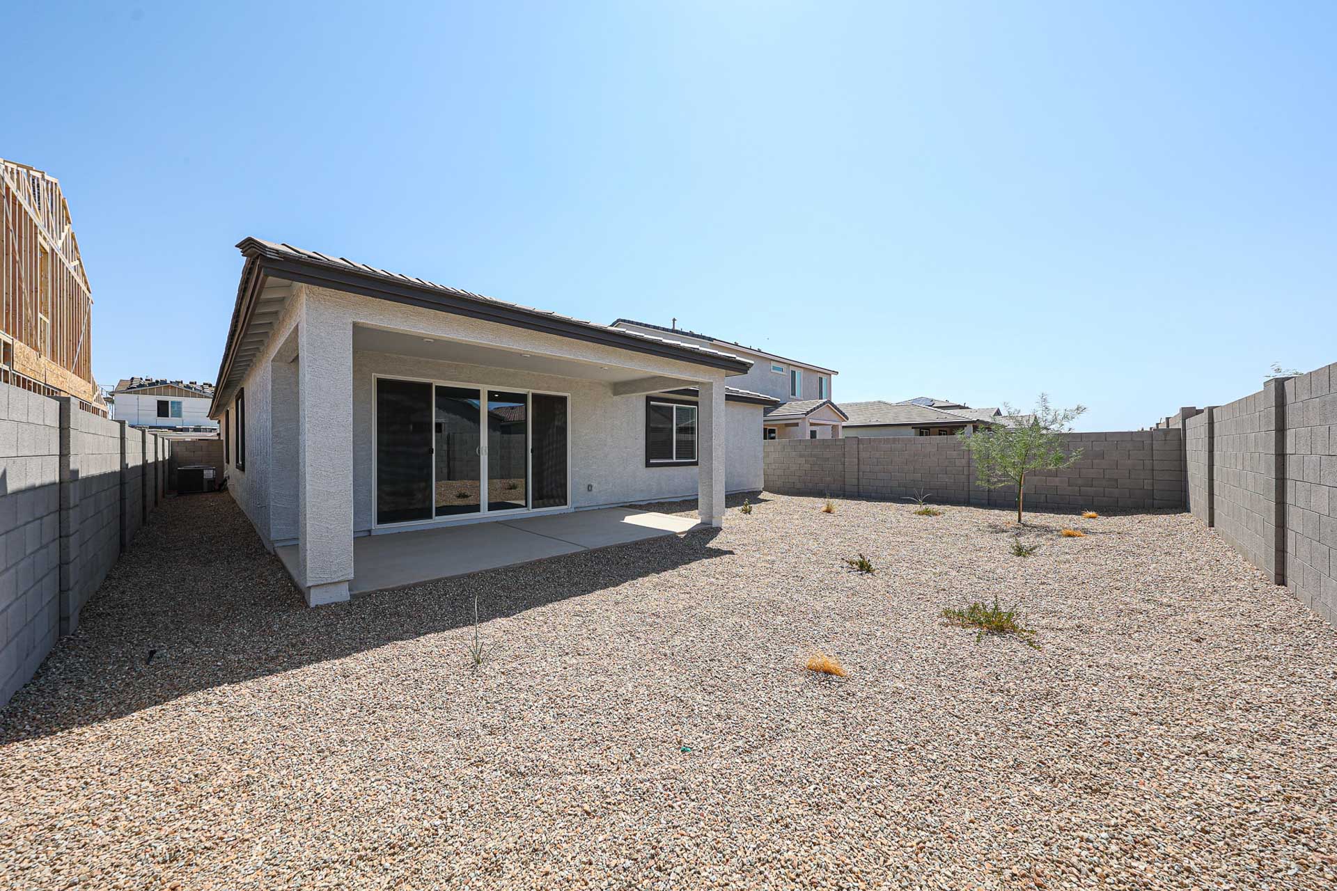 A house with a gravel yard.