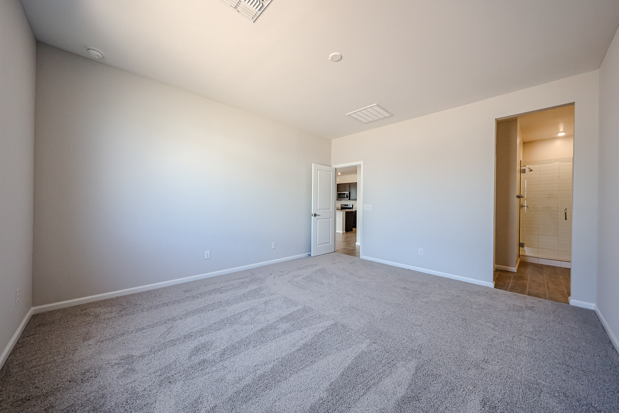 A hallway with white walls.