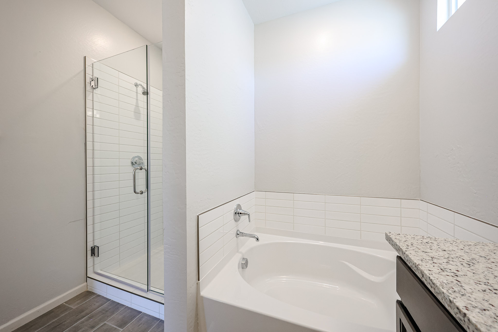 A bathroom with a glass shower.