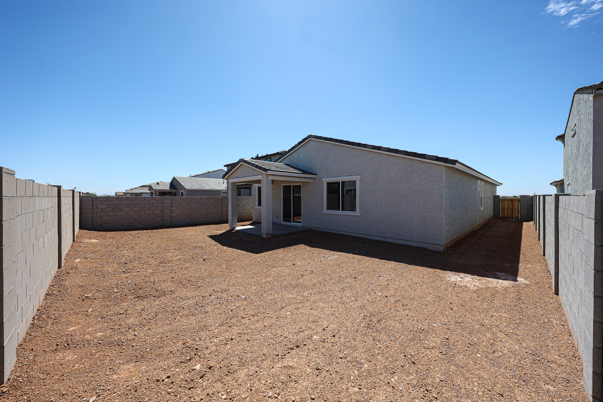 A house in a dirt field.