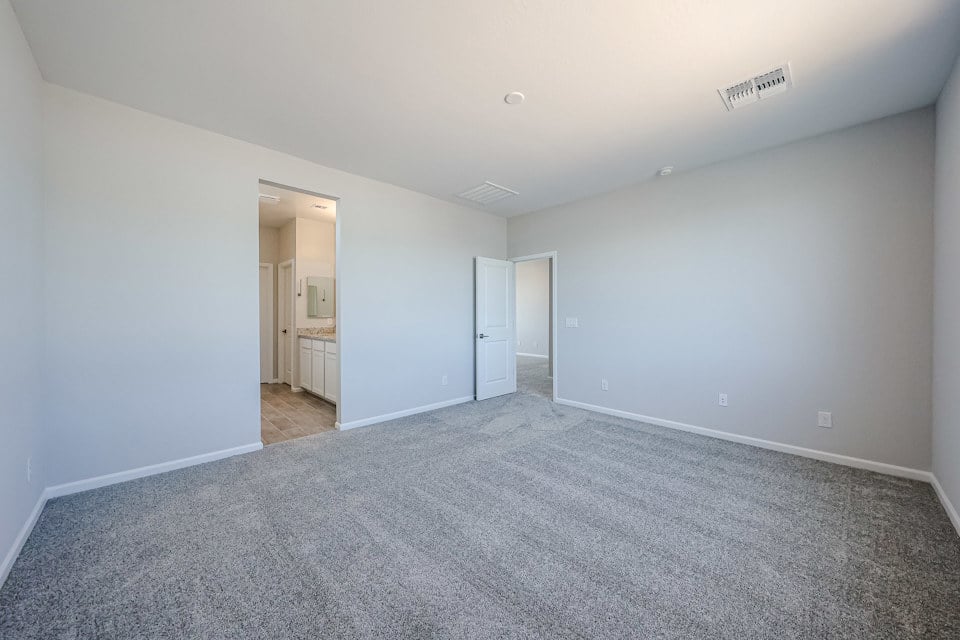 A long hallway with white walls.