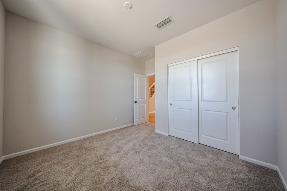 A hallway with white doors.
