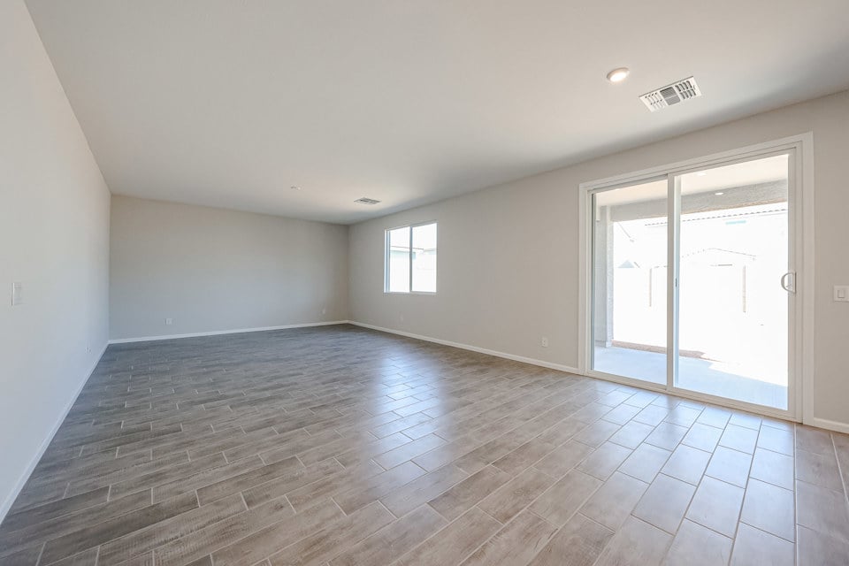 A room with a wood floor and a wood floor.