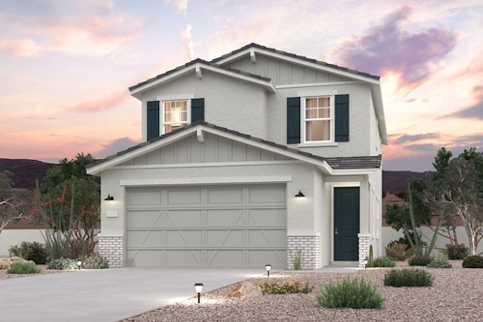 A white house with a garage.