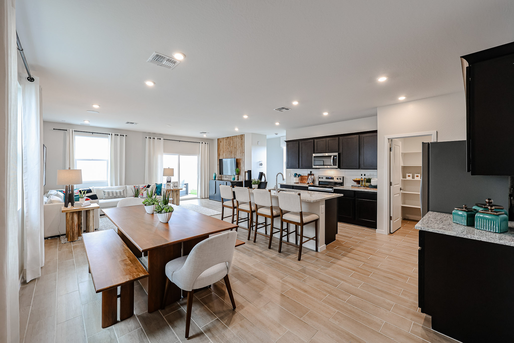 A large kitchen with a large dining table.