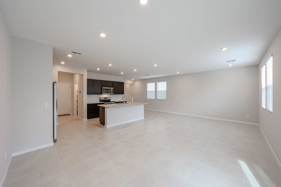 A large kitchen with white tile.