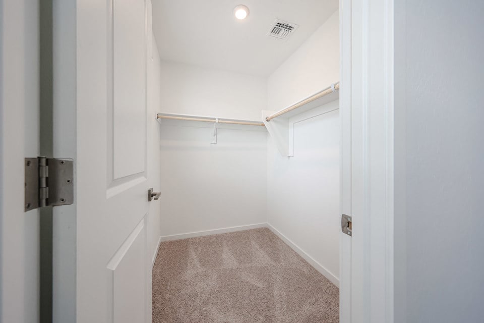 A hallway with white doors.