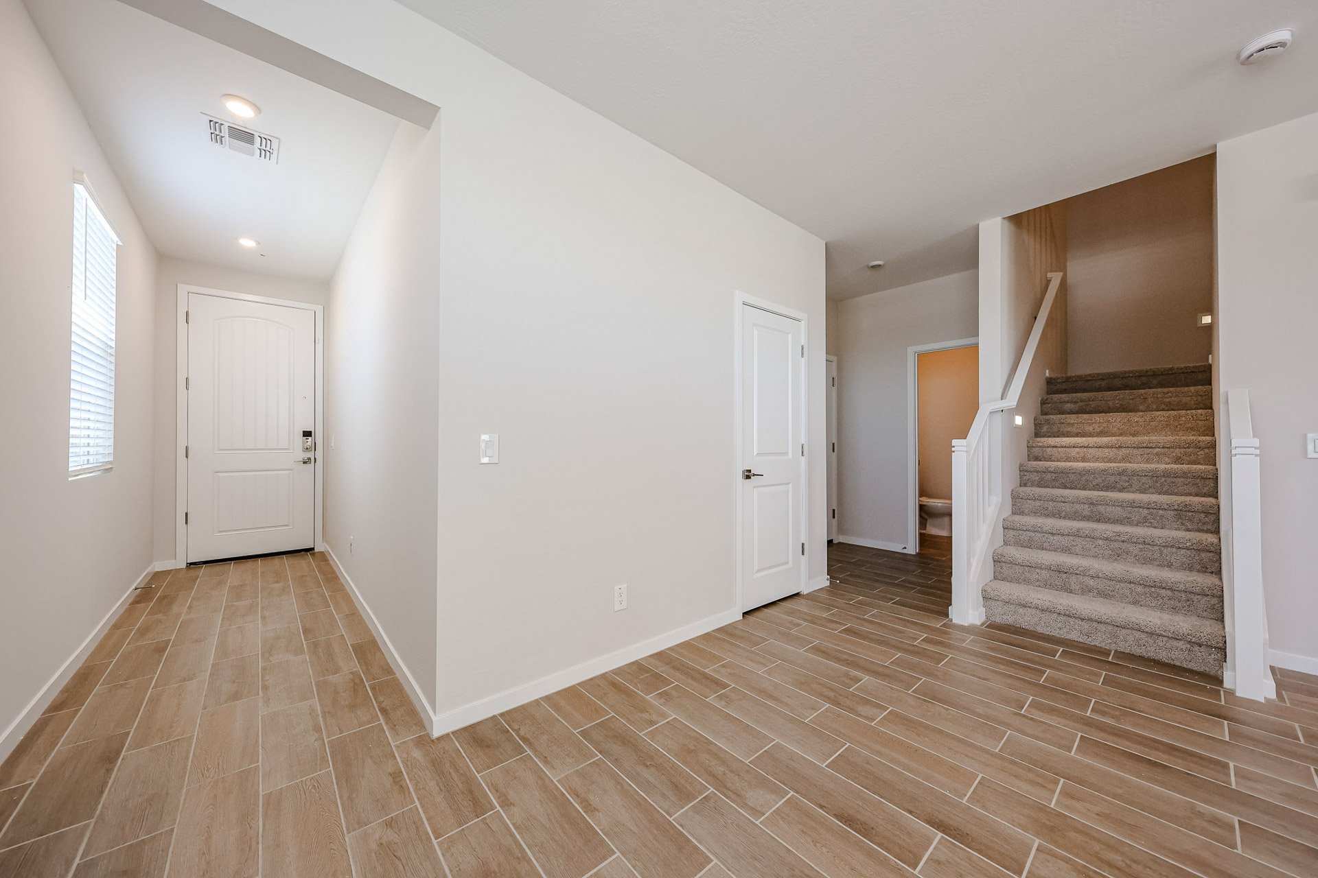 A hallway with white doors.