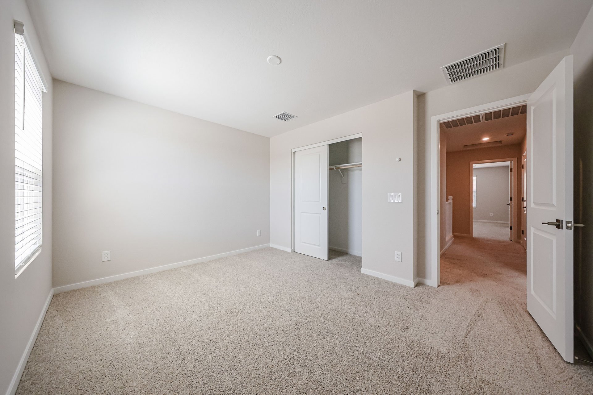 A hallway with white walls.