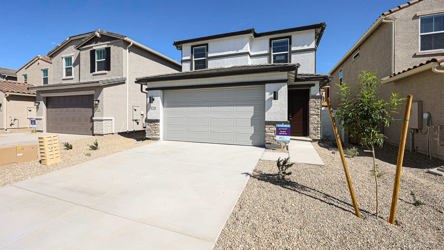 A house with garages and a driveway.