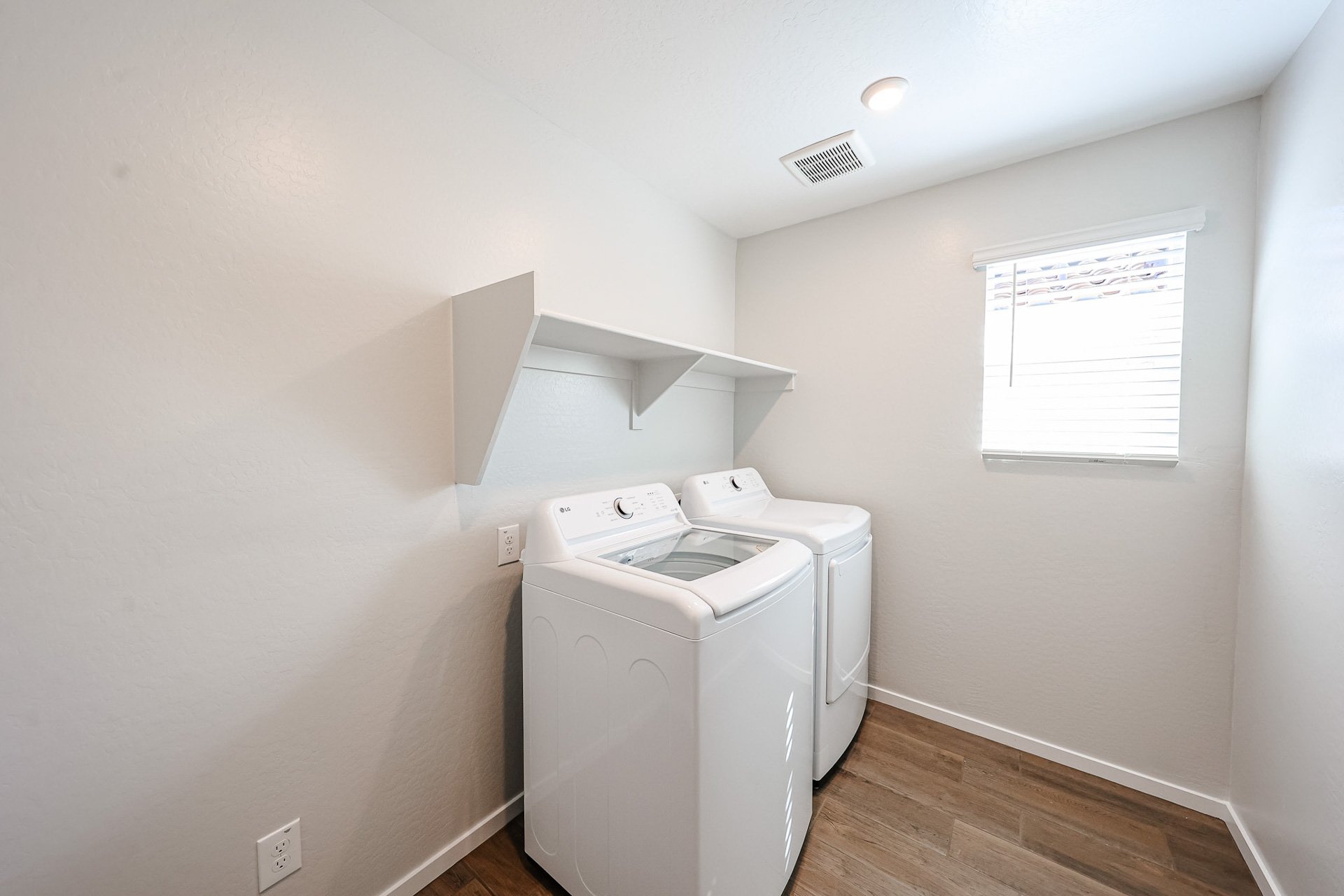 A laundry room with a washer and dryer.
