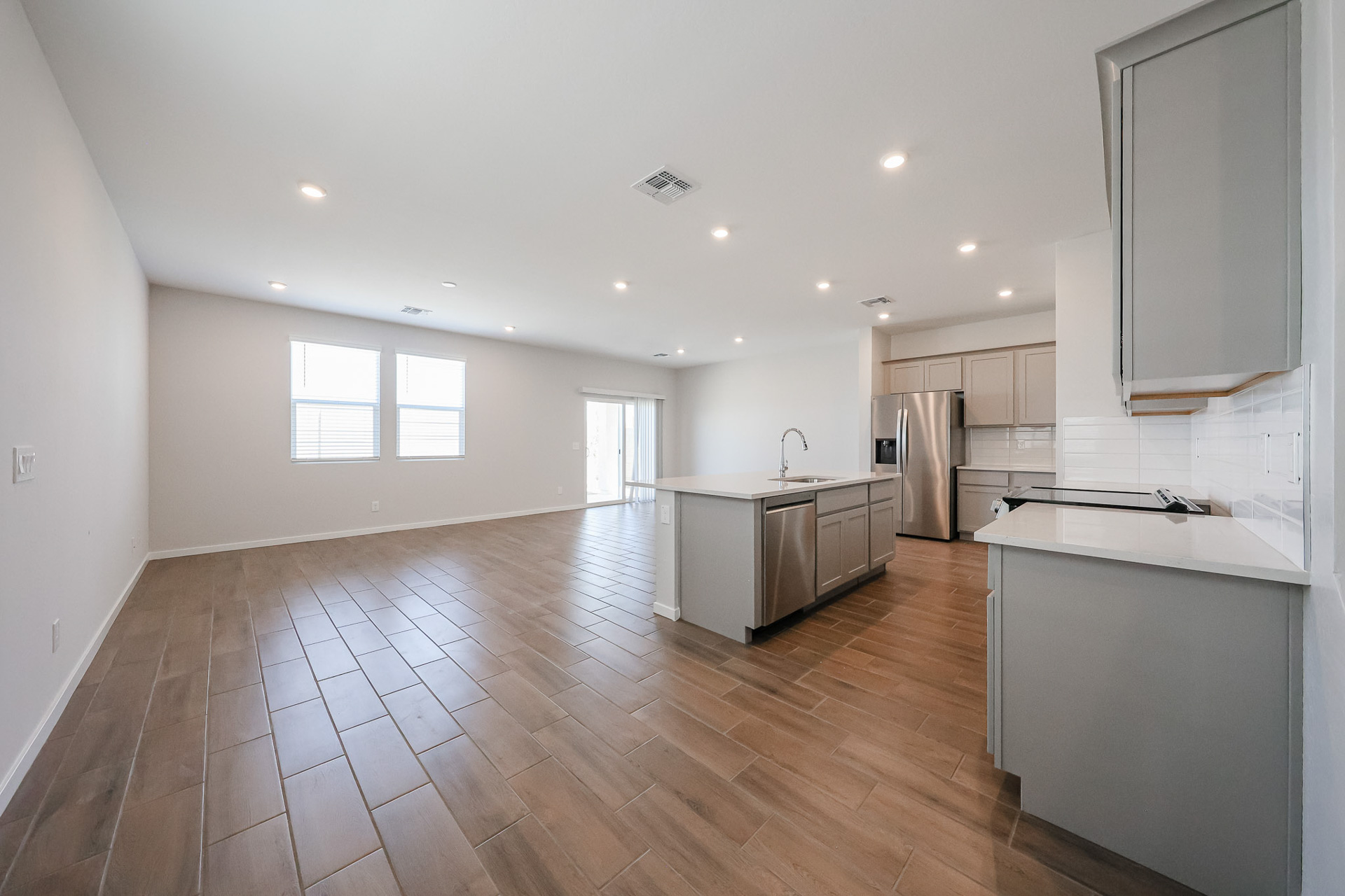 A kitchen with wooden floors.