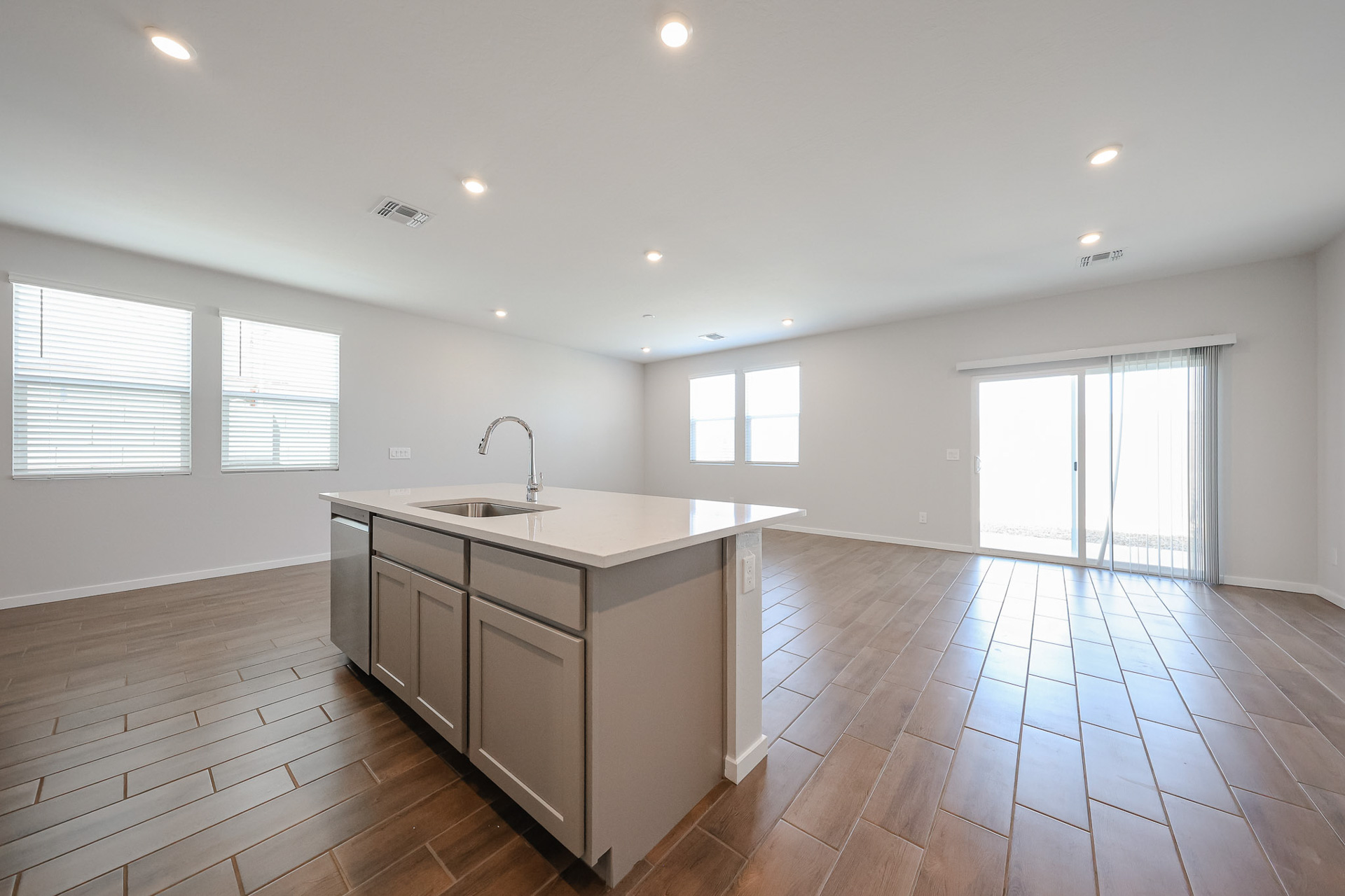 A kitchen with a wood floor.
