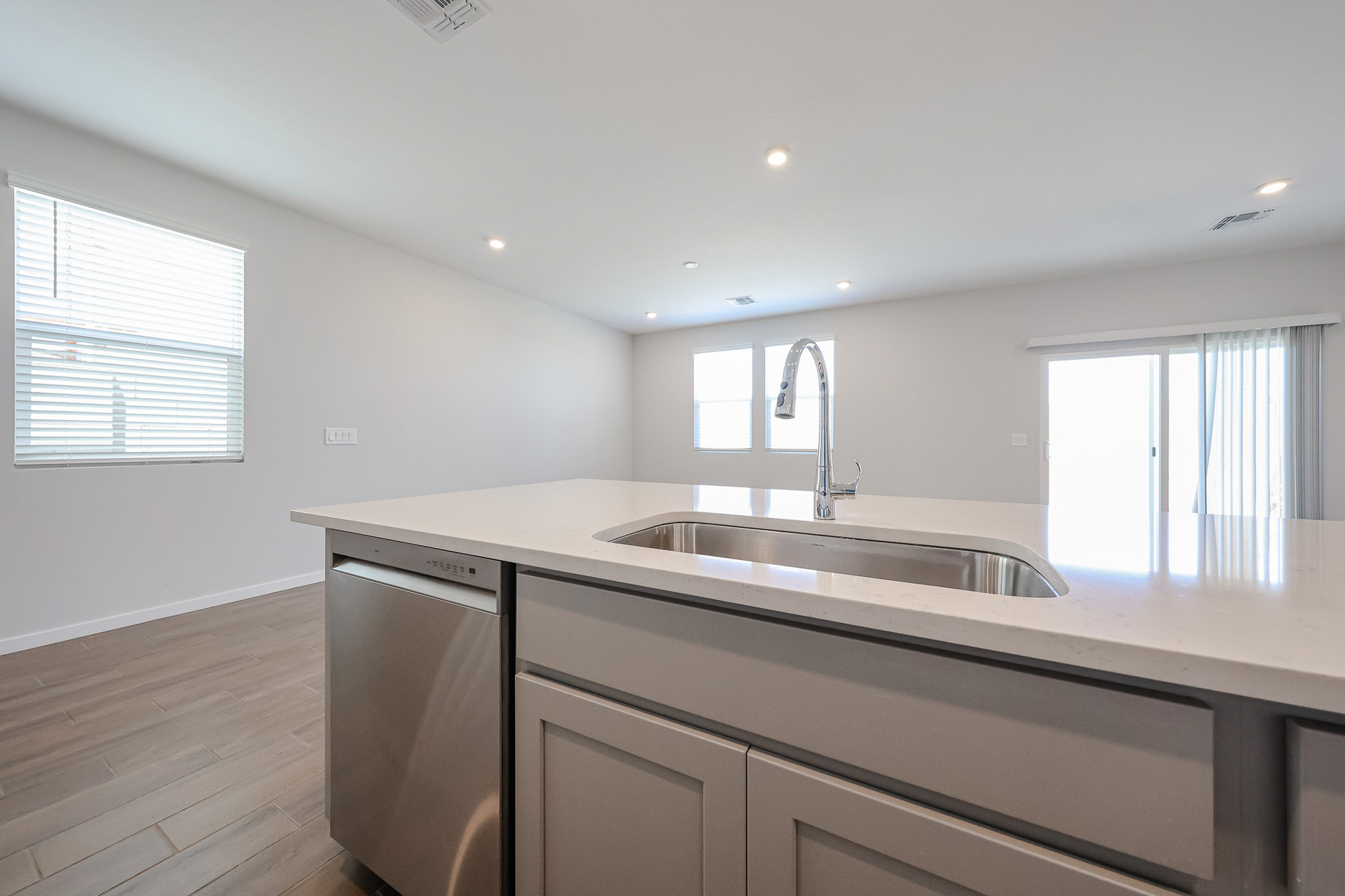 A kitchen with a sink and a window.