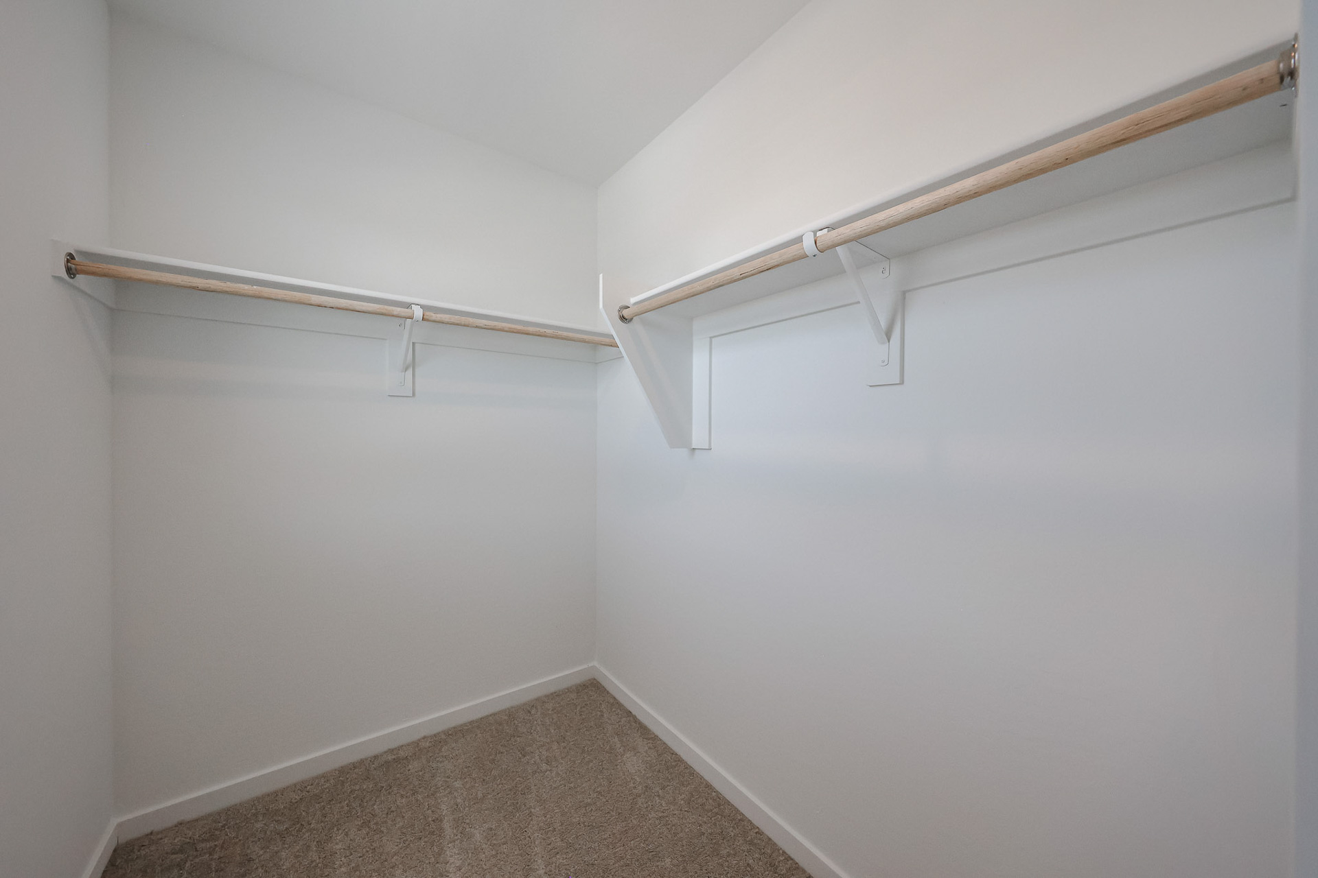 A white wall with a white ceiling.