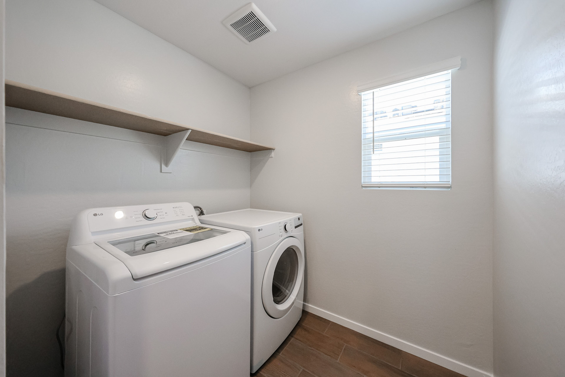 A washing machine in a room.