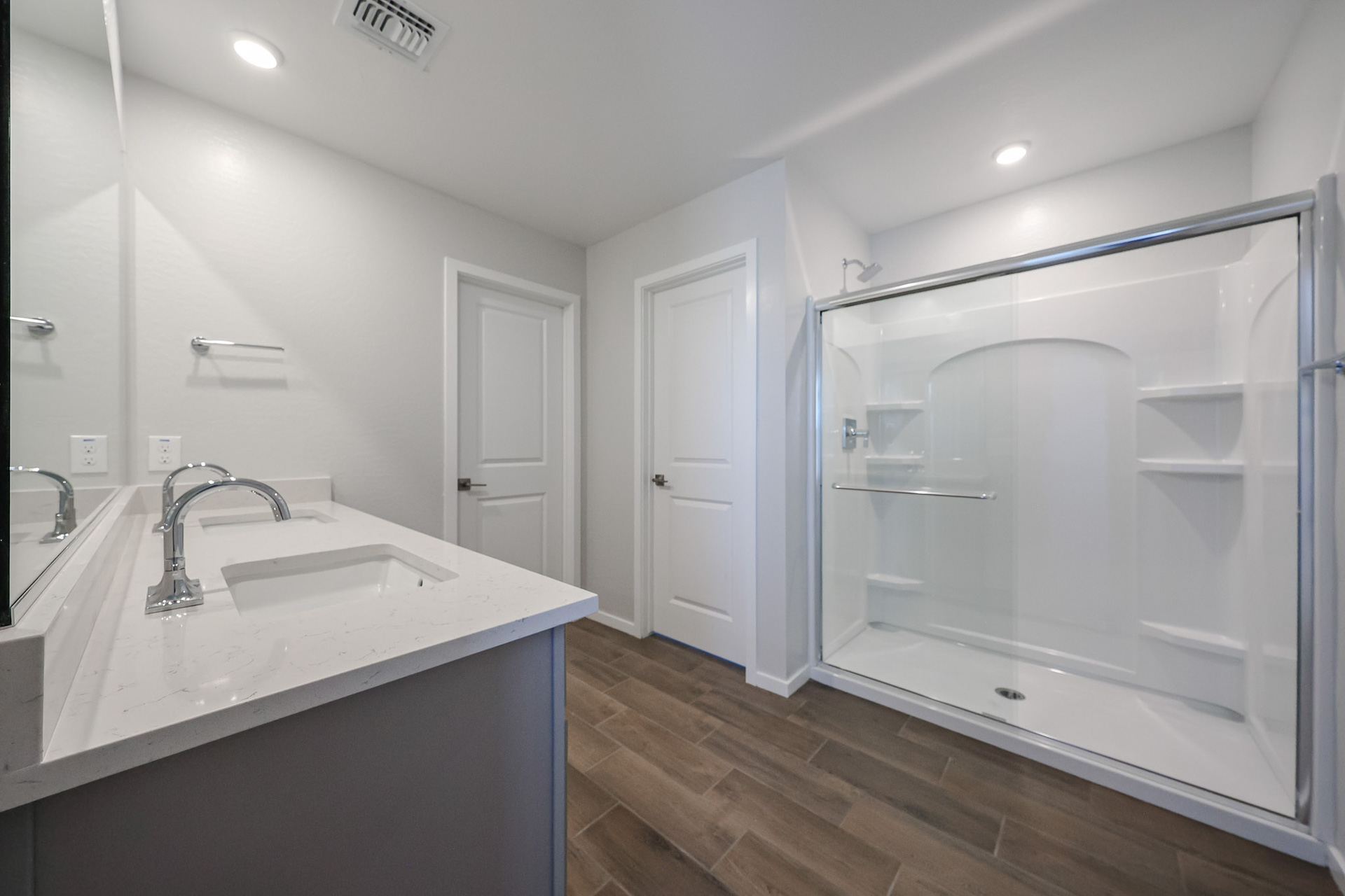 A bathroom with a glass shower.