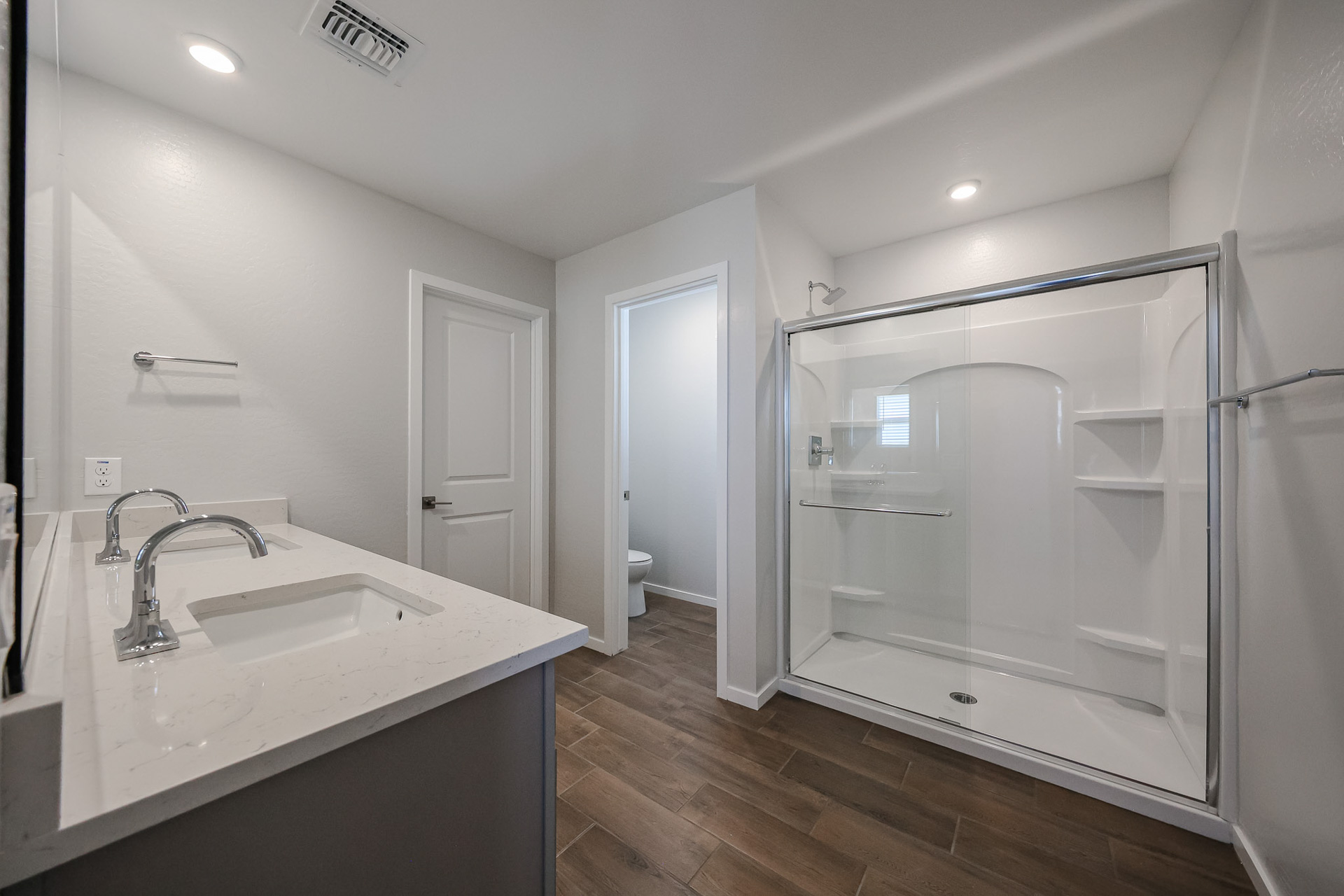 A bathroom with a glass shower.