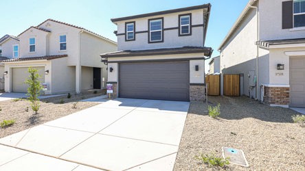 A driveway leading to a house.