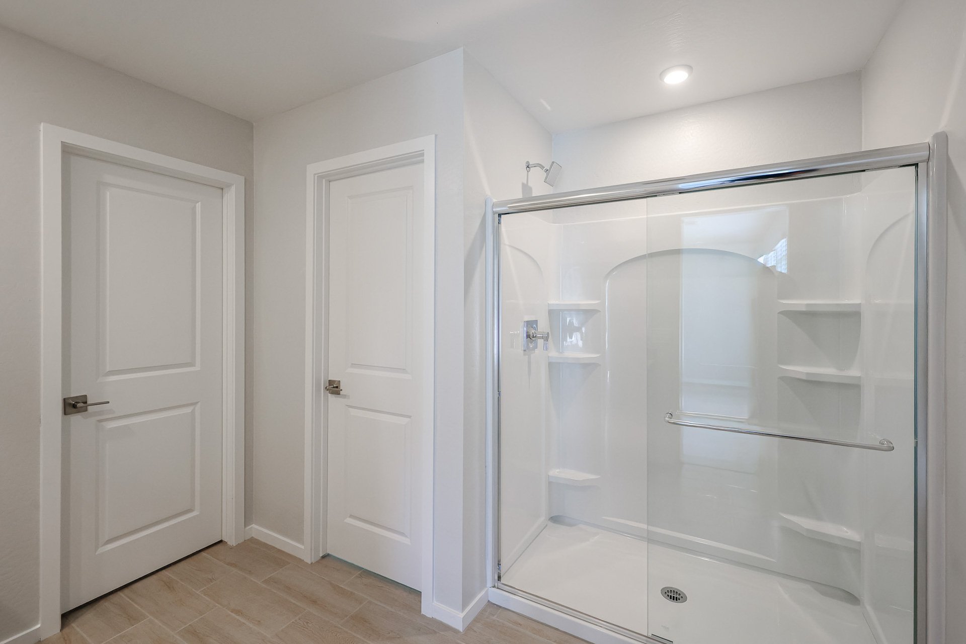 A bathroom with a glass shower.