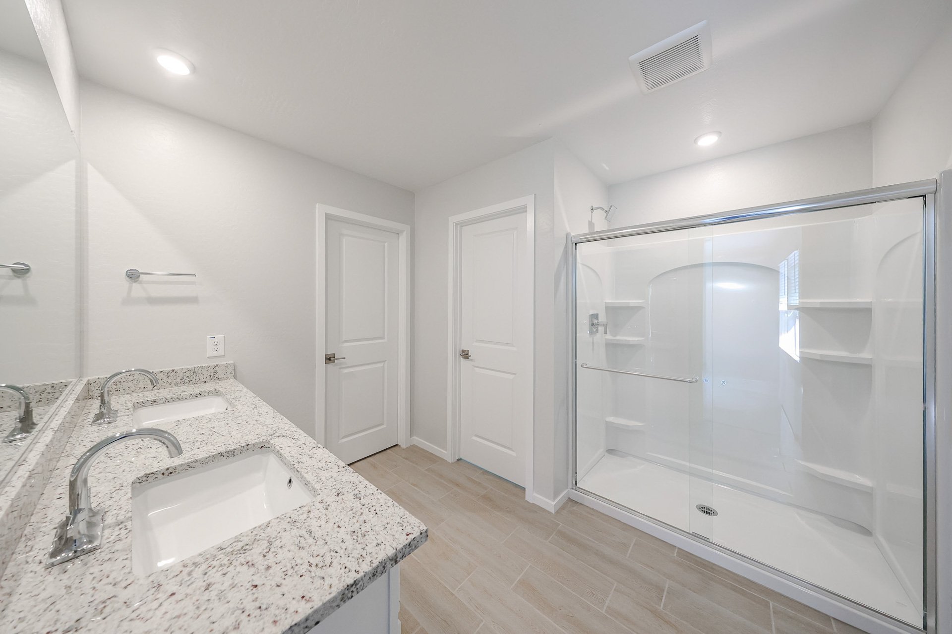 A bathroom with a glass shower.