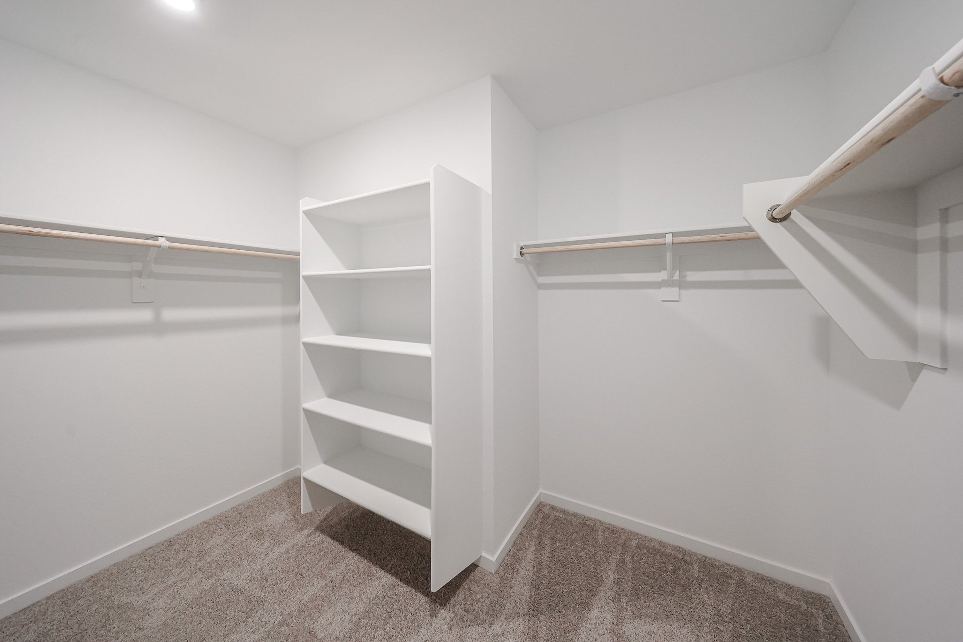 A white staircase in a room.