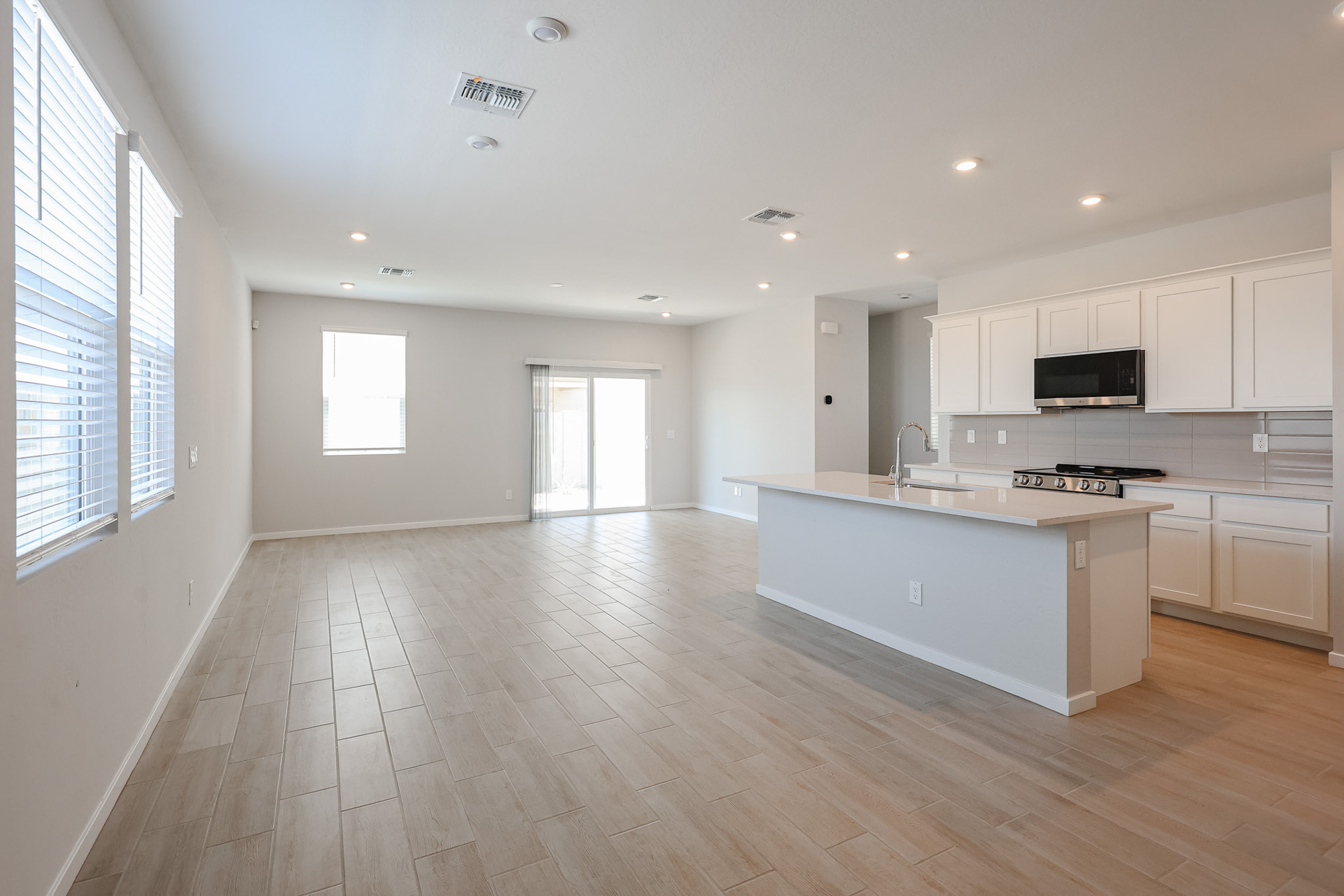 A large kitchen with white cabinets.