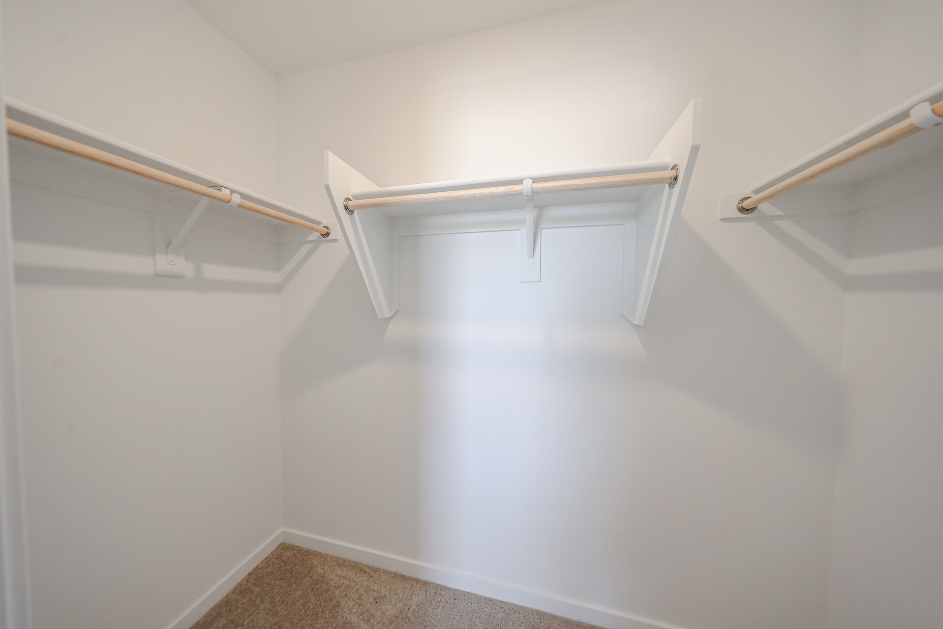 A white staircase with a metal railing.