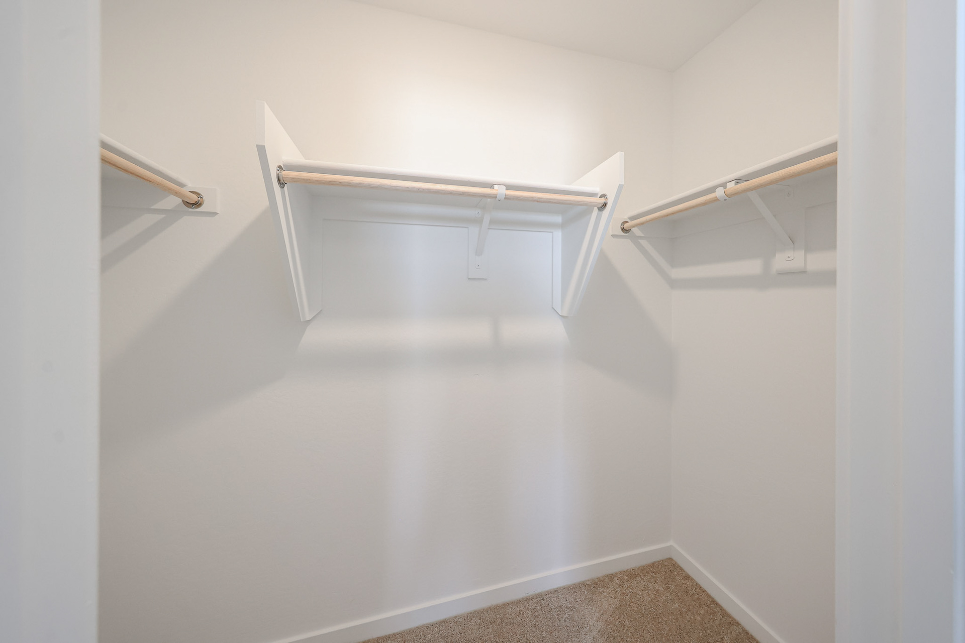 A white staircase with a metal railing.
