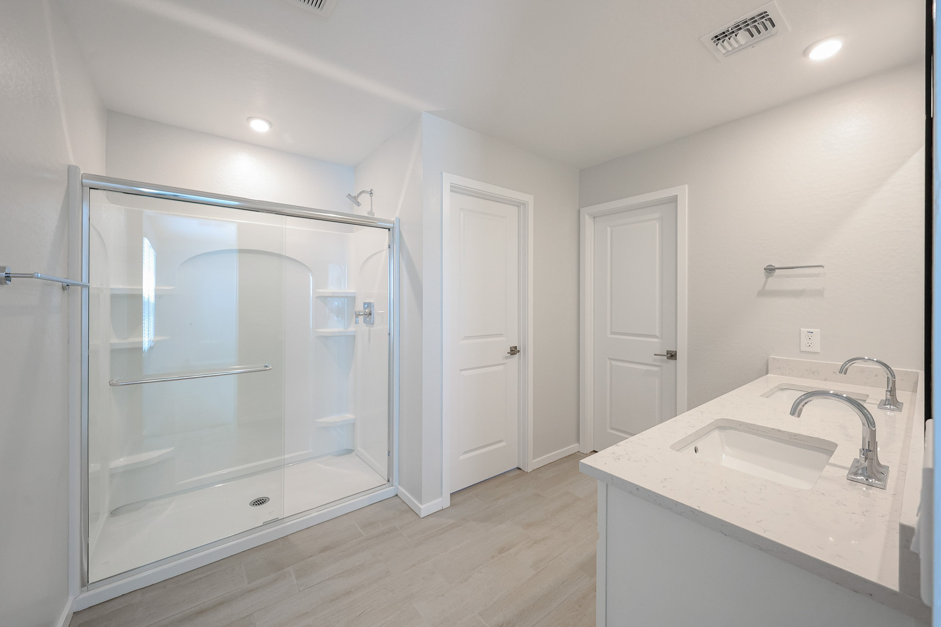 A bathroom with a glass shower.