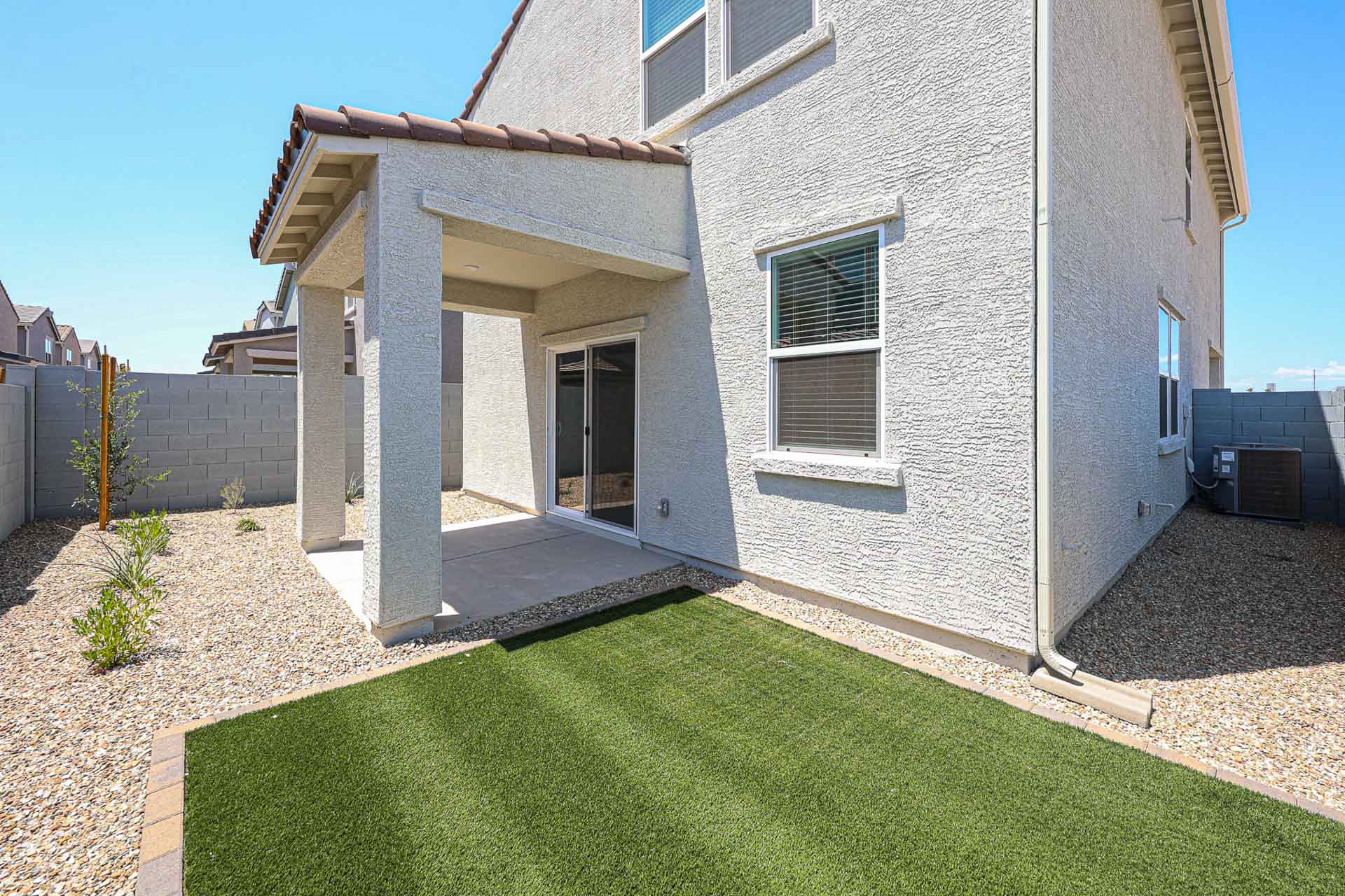 A house with a green lawn.