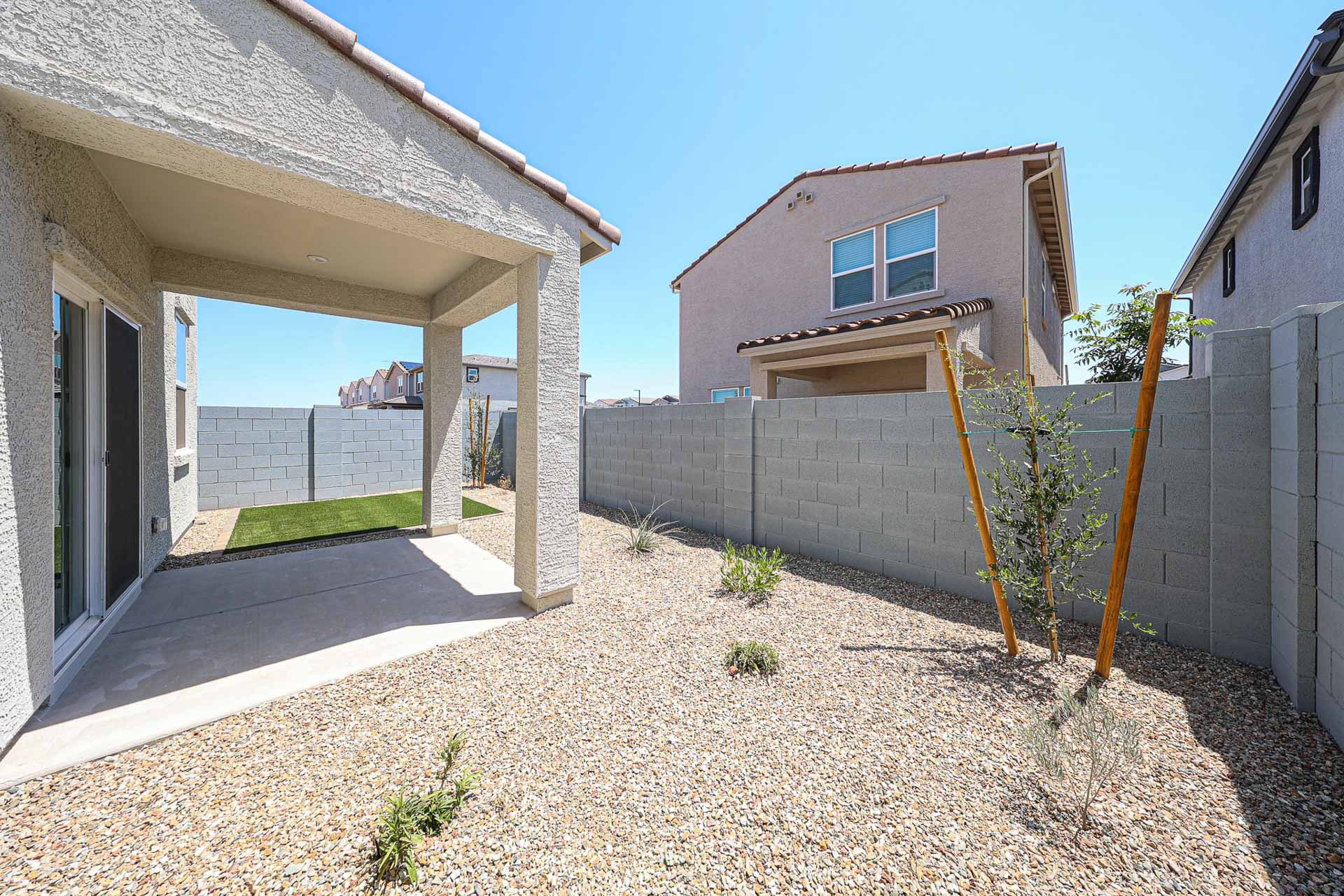 A house with a stone patio.