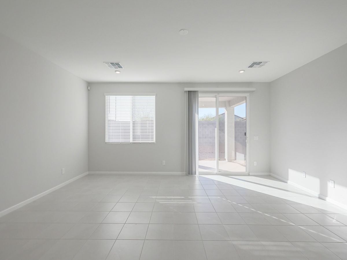 A room with a tile floor and windows.
