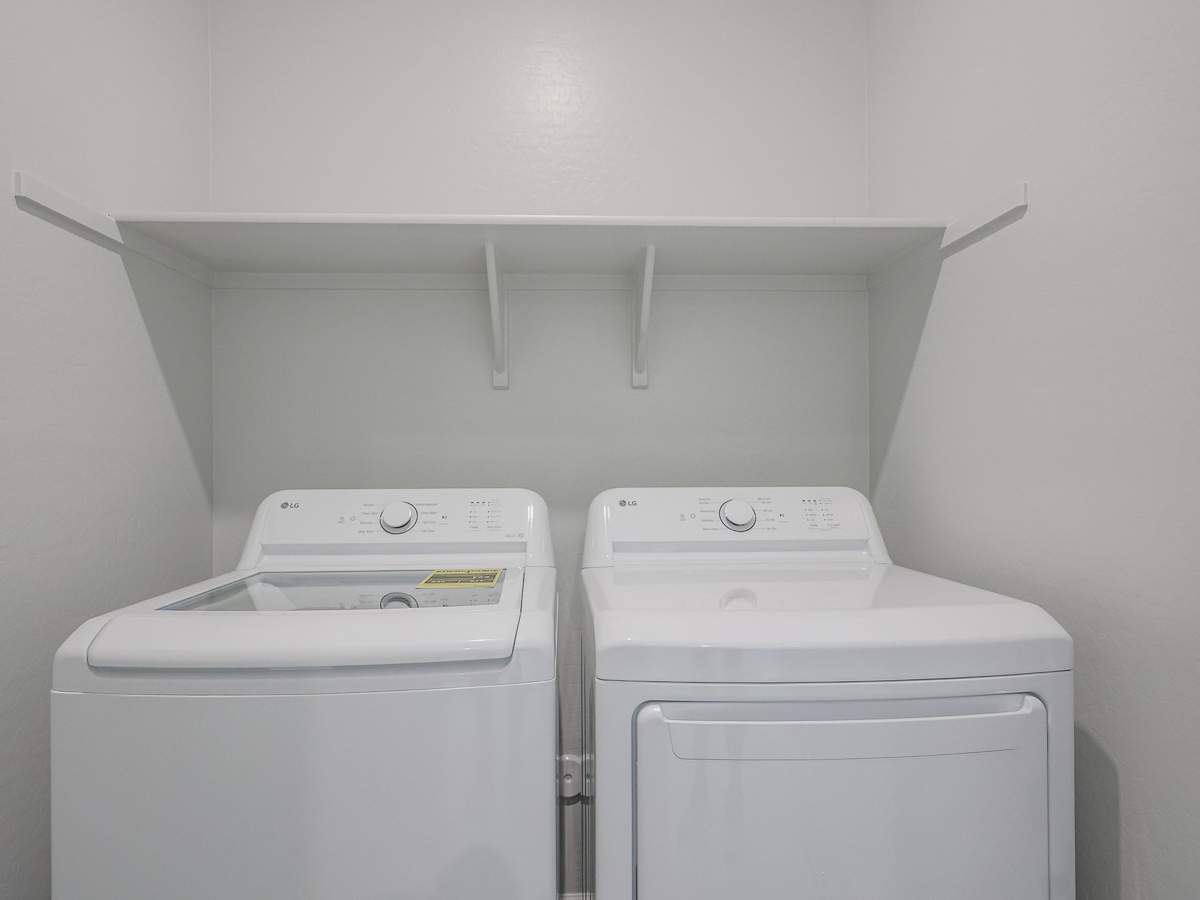 A washing machine in a room.