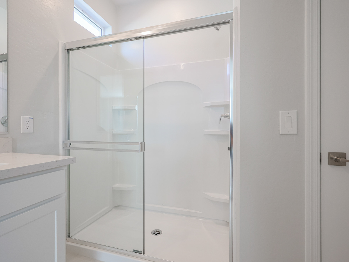 A bathroom with a glass shower.
