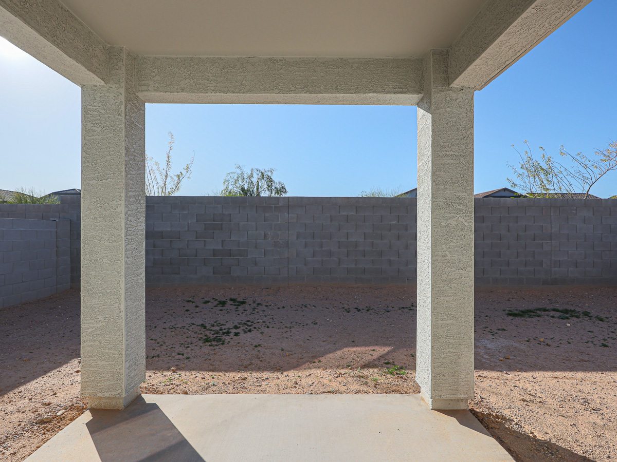 A stone wall with pillars.